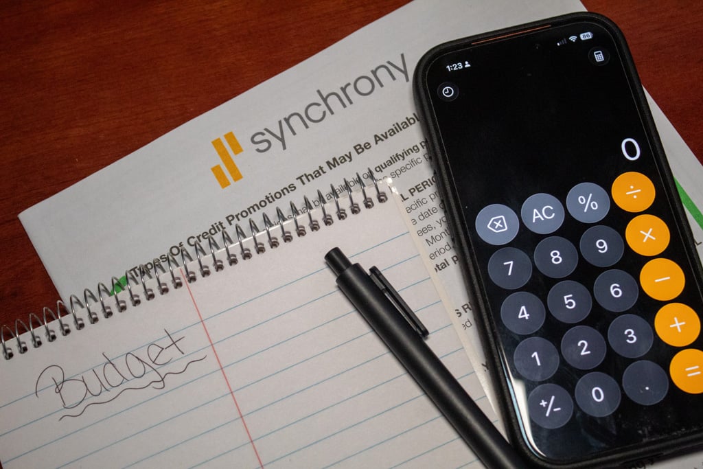 Calculator with pen and notebook