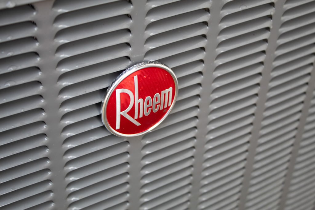 Close-up of the Rheem logo on HVAC equipment installed by Honest Fix.