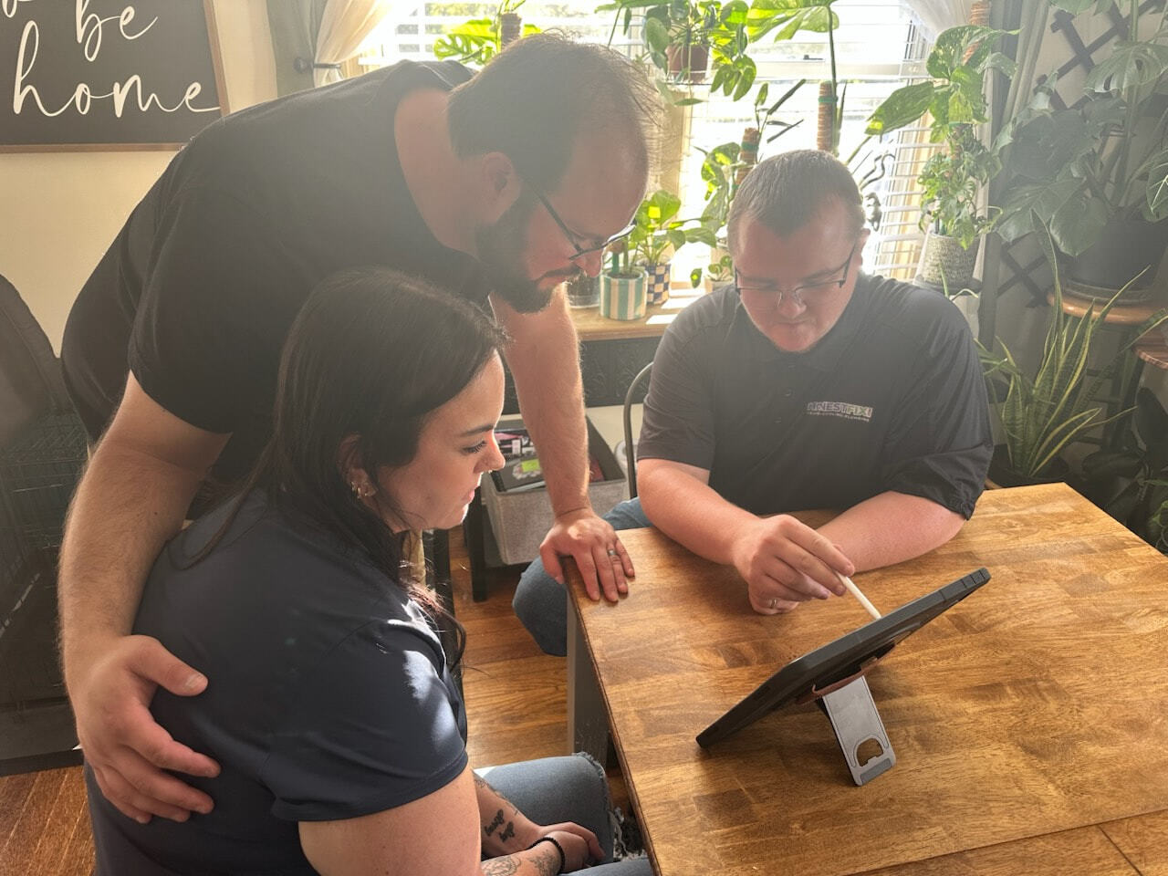 Owner Alex Largent of Honest Fix Heating, Cooling & Plumbing reviewing HVAC options with homeowners in Steubenville, OH.