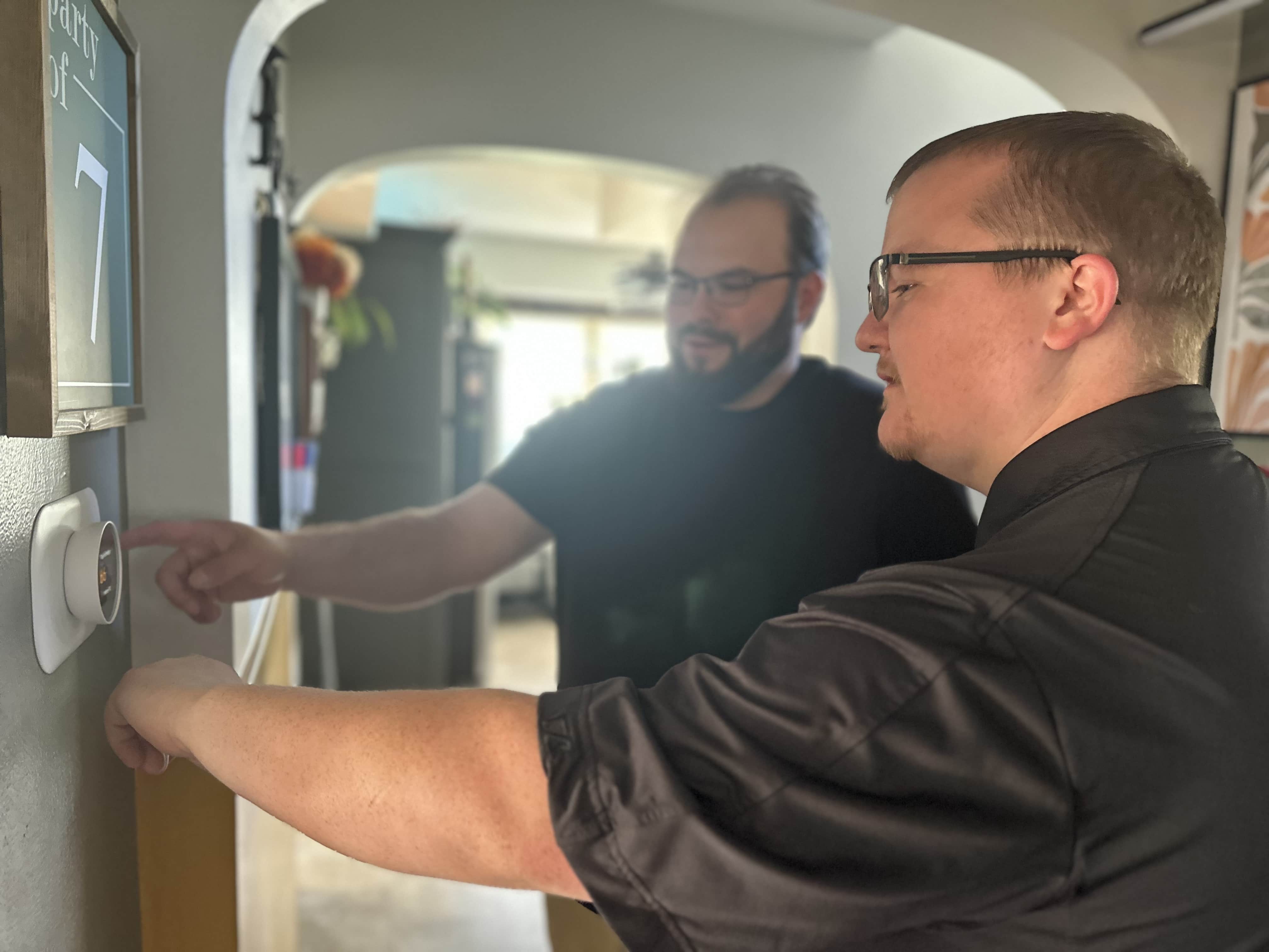honest-fix-owner-alex-largent-thermostat-demonstration-steubenville-oh.jpg