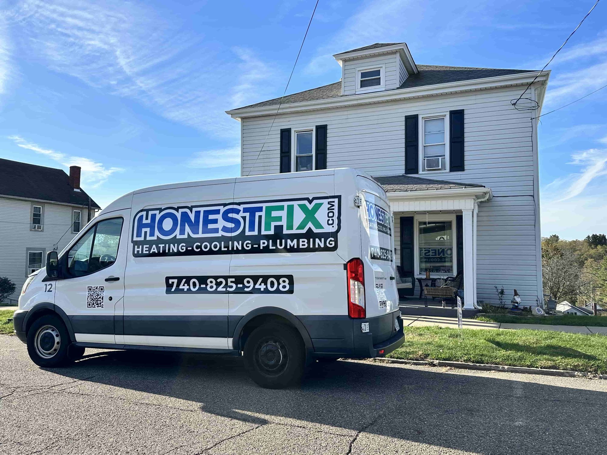 Honest Fix Heating, Cooling & Plumbing service van parked outside a home in Steubenville, OH, representing trusted local HVAC and plumbing service.